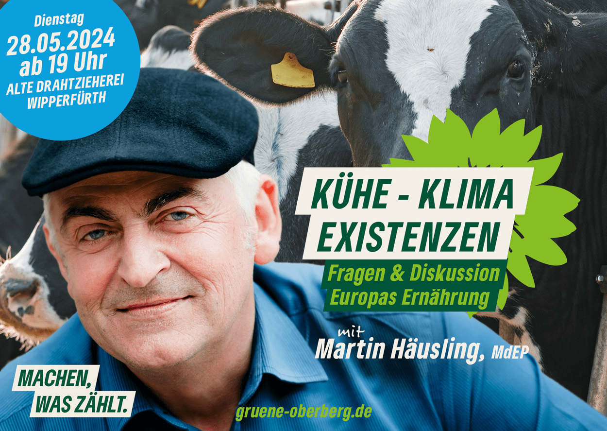 Der Kopf von Martin Häusling vor Kühen